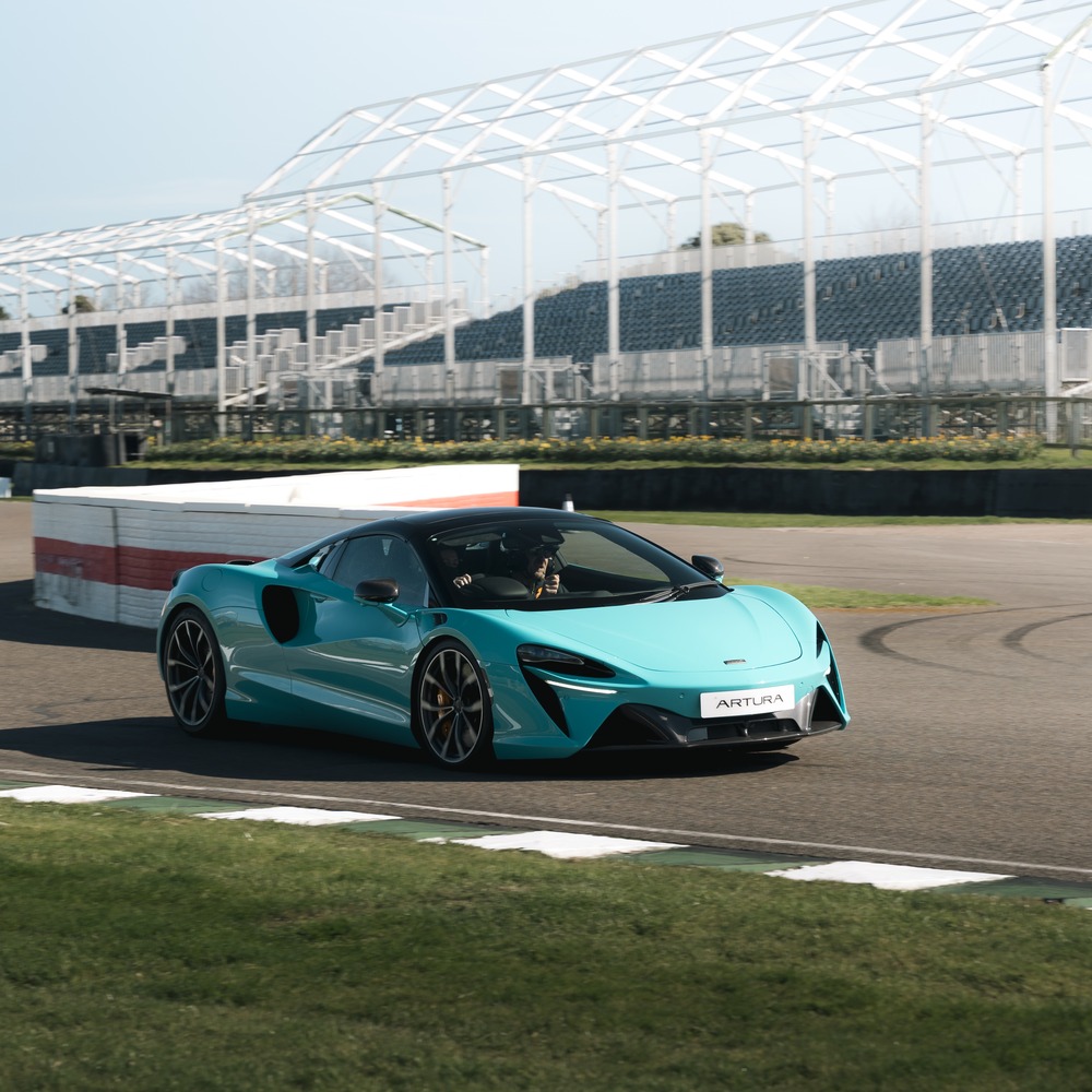 McLaren Artura on the Goodwood circuit in front of the grandstand